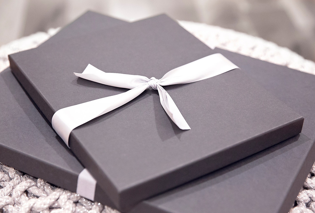 Child photography studio prints delivered in a boutique package